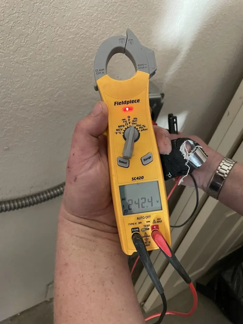 Voltage testing with clamp meter during Electrical Installation Services in Ocean